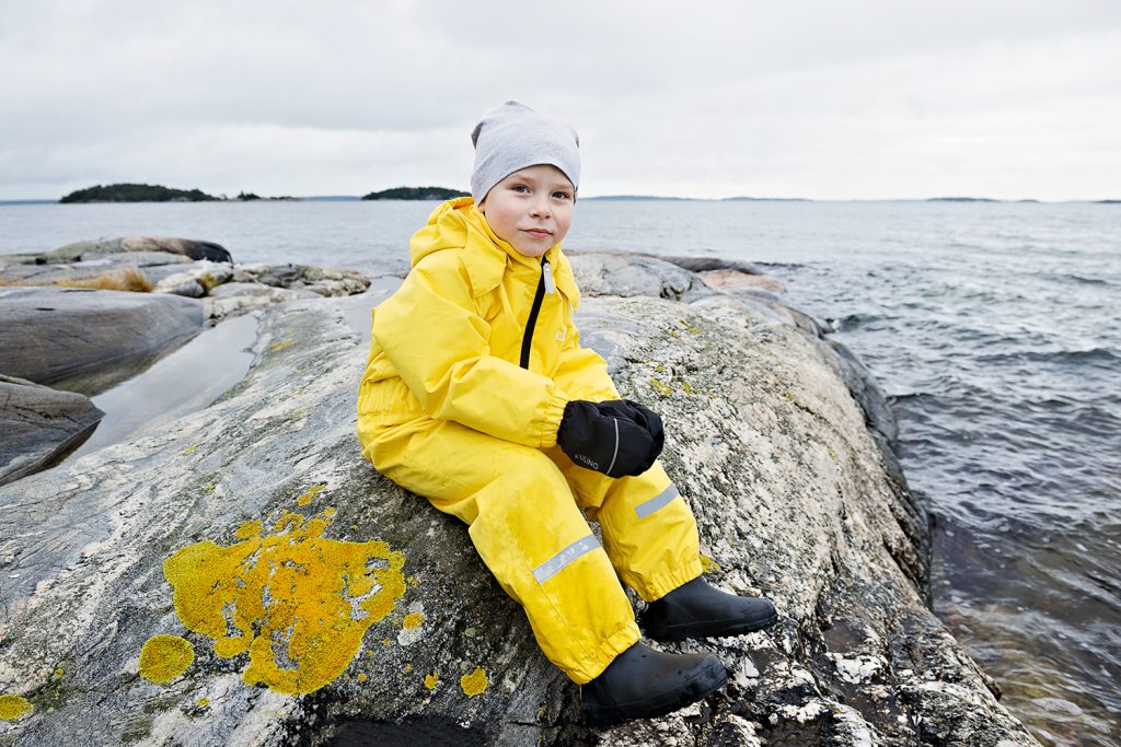 Child in outdoor lifestyle photoshoot by the ocean