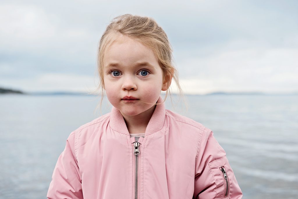 Child in outdoor lifestyle photoshoot by the ocean