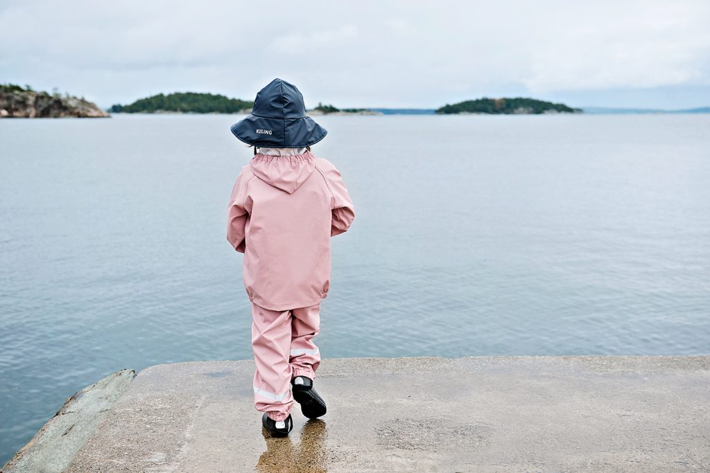 Child in outdoor lifestyle photoshoot by the ocean